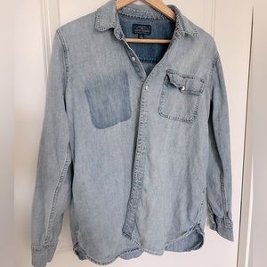 Denim shirt with white metal buttons